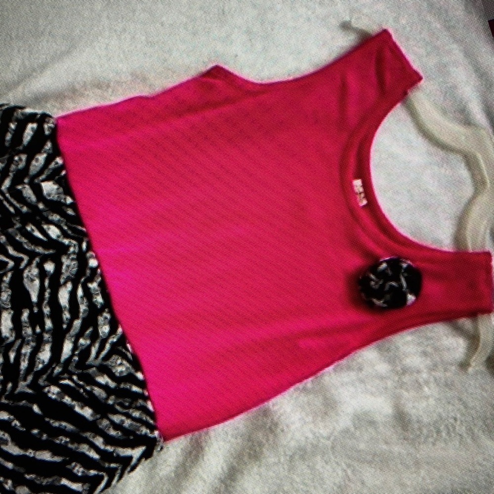 Features vibrant sleeveless crew neck sundress